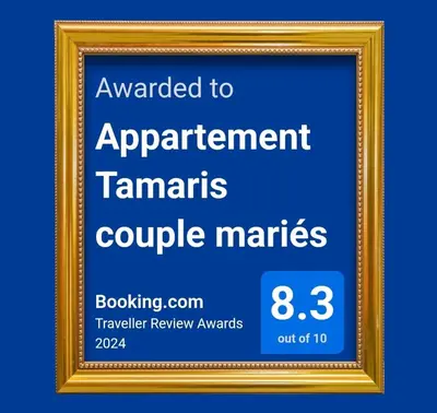 a picture frame with a sign that says upgraded to apartment tamars couple markets at Appartement Tamaris couple mariés in Tamaris