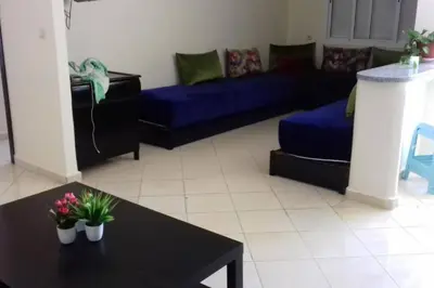 a living room with a couch and a table at Appartement Tamaris couple mariés in Tamaris