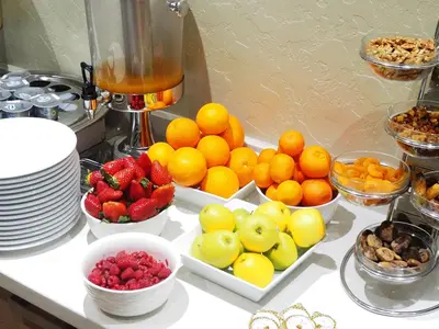 a counter with bowls of fruit and bowls of nuts at Le 22 Appart'Hotel in Casablanca