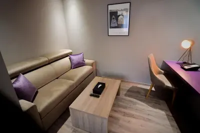a living room with a couch and a coffee table at Le 22 Appart'Hotel in Casablanca