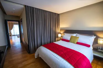 a bedroom with a large bed with a red blanket at Gray Boutique Hotel Casablanca in Casablanca