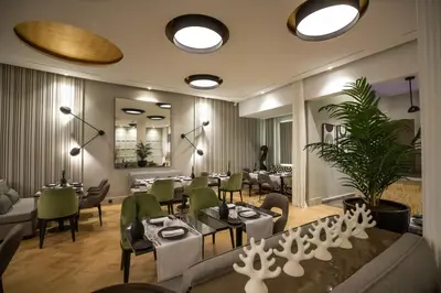 a restaurant with tables and chairs in a room at Gray Boutique Hotel Casablanca in Casablanca