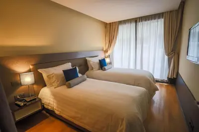a hotel room with two beds and a window at Gray Boutique Hotel Casablanca in Casablanca