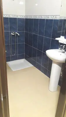 a bathroom with a shower and a sink at Joudia in Temara