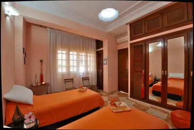 a hotel room with two beds and a window at LHOSTEL à Casablanca in Casablanca