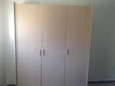 a pair of white closets in a room at Familly Apartement Agdal Rabat centre in Rabat