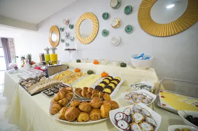 a table with many different types of food on it at Hôtel du Golf Mohammedia in Mohammedia
