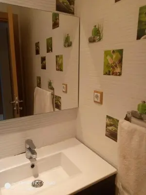 a bathroom with a sink and a mirror at residance a 100 m de la mer in El Harhoura