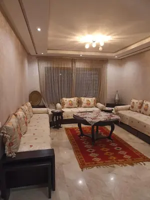 a living room with a couch and a table at Nouaceur Garden Comfort and Serenity Casa Airport in Nouaseur