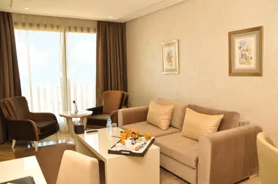 a living room with a couch and a table at Suite Hotel Casa Diamond in Casablanca