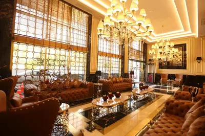 a large lobby with couches and a chandelier at Suite Hotel Casa Diamond in Casablanca