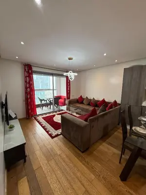 a living room with a couch and a table at Appartement Casa-marina au 10ème étage in Casablanca