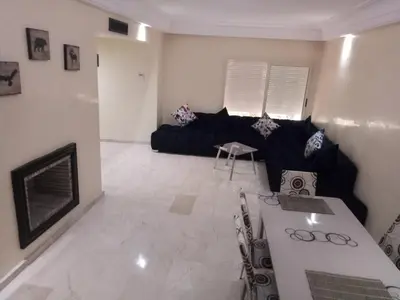 a living room with a couch and a table at Apartment with Terrace in Casablanca