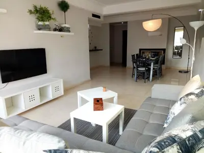 a living room with a couch and a tv at Apartment with Terrace in Casablanca