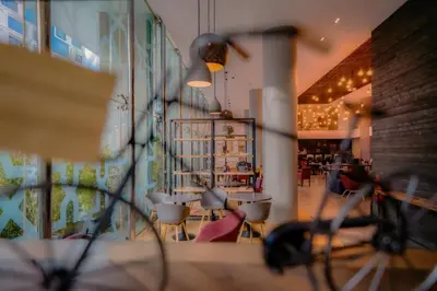a view of a restaurant with tables and chairs at Campanile Casablanca Centre Ville in Casablanca
