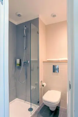 a bathroom with a shower and a toilet at Premiere Classe Casablanca Centre Ville in Casablanca