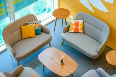 a living room with two chairs and a table at Premiere Classe Casablanca Centre Ville in Casablanca