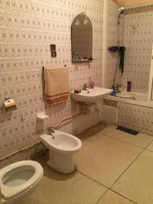 a bathroom with a toilet and a sink at Property in a quiet area close to the train station and town in Casablanca