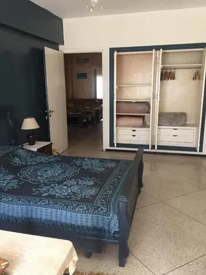 a bedroom with a bed and two bunk beds at Property in a quiet area close to the train station and town in Casablanca
