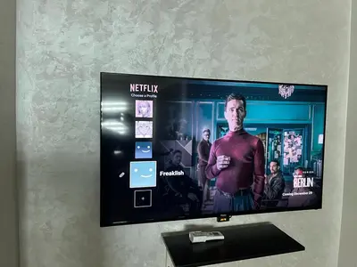 a flat screen tv hanging on a wall at home zen in Rabat