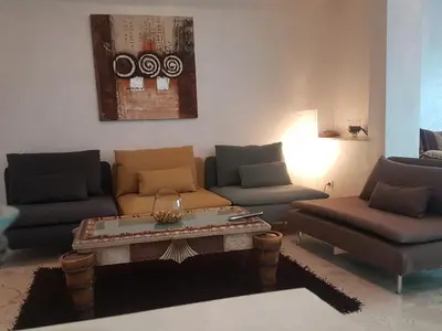 a living room with two couches and a coffee table at home zen in Rabat