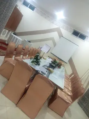 an overhead view of a dining room with a table and chairs at reda land in O Ben Slimane