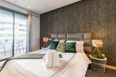 a bedroom with a large bed with pillows at COMFORTABLE & ELEGANT FLAT IN A LIVELY PLACE by ShortstayMaroc in Casablanca