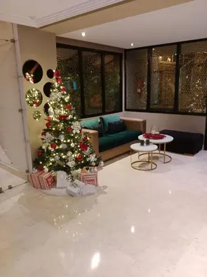 a christmas tree in the middle of a living room at Yto boutique Hotel in Casablanca