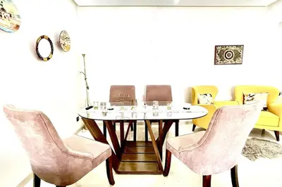 a dining room with a table and chairs at Taj nouaceur aéroport Mohamed V in Nouaseur