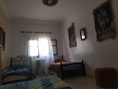 a bedroom with two beds and a window at appartement a casablanca in Casablanca