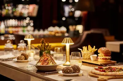 a table topped with plates of food and snacks at Hyatt Regency Casablanca in Casablanca
