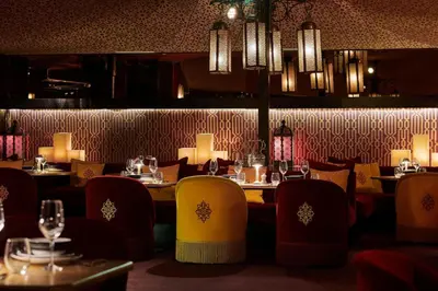 a dining room with tables and chairs and lights at Hyatt Regency Casablanca in Casablanca