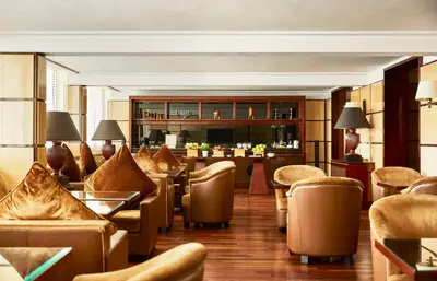 a hotel lobby with couches and a bar at Hyatt Regency Casablanca in Casablanca