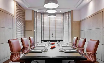 a conference room with a long table and chairs at Hyatt Regency Casablanca in Casablanca