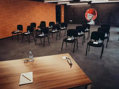 a room with chairs and a table with an envelope at ONOMO Hotel Casablanca Sidi Maarouf in Casablanca