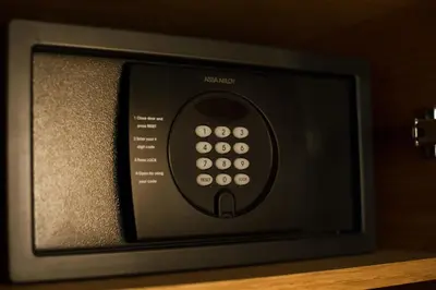 a television with a remote control sitting on a shelf at ONOMO Hotel Casablanca Sidi Maarouf in Casablanca