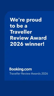 a blue sign that says were proud to be a traveller reviewagency winner at Appartement avec terrasse au cœur du centre-ville de Rabat in Rabat