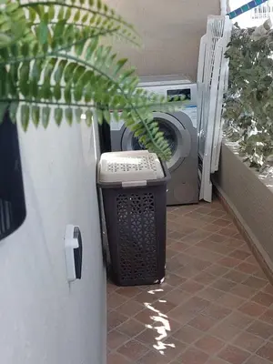 a washer and dryer sitting next to a washing machine at Appartement avec terrasse au cœur du centre-ville de Rabat in Rabat