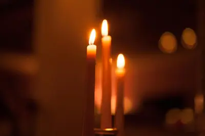 two candles are lit up in the dark at Villa Des Ambassadors in Rabat