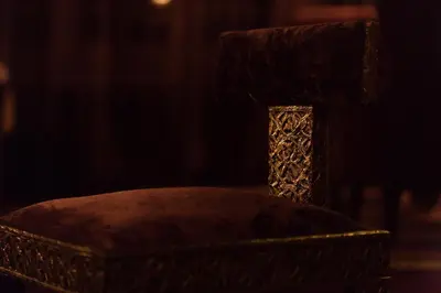 a close up of a chair in a dark room at Villa Des Ambassadors in Rabat