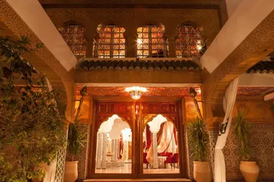 a room with a large wooden door in a building at Villa Des Ambassadors in Rabat