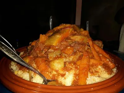 a bowl of food with two spoons in it at Riad Nabila in Casablanca