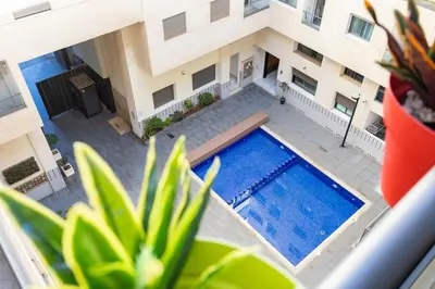 an overhead view of a swimming pool in a building at Miramar Residence Beach in Mohammedia