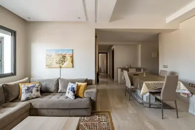 a living room with a couch and a table at Champs Elysee in Casablanca