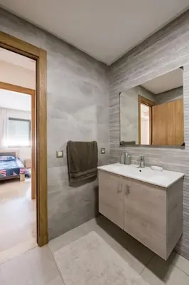 a bathroom with a sink and a mirror at Champs Elysee in Casablanca