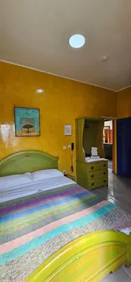 a bedroom with a large bed and a mirror at Ryad 91 in Casablanca