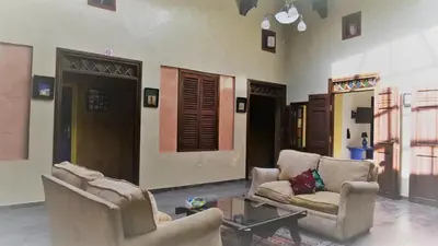 a living room with two chairs and a coffee table at Ryad 91 in Casablanca