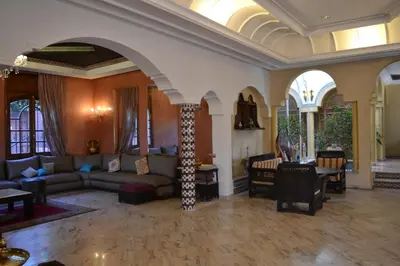 a living room with a couch and a table at Dar Tahra in Casablanca