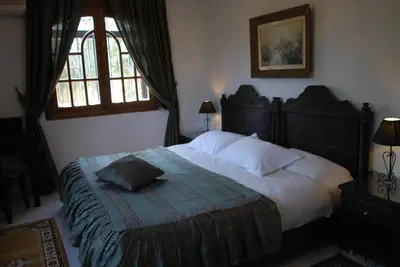 a bedroom with a bed and a window at Dar Tahra in Casablanca