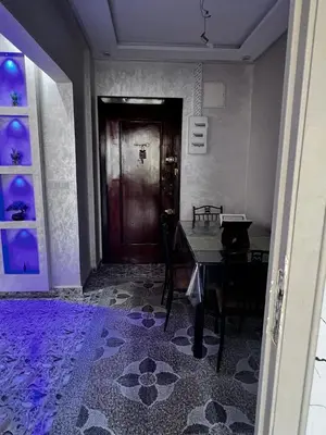 a dining room with a table and a door at le spatieux in Casablanca